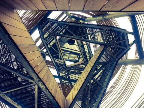 Iron staircase that makes a triangular geometric shape - great for a wallpaper 스톡 사진