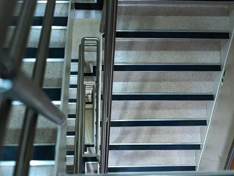 The iron staircase is seen from above. Stock Photos