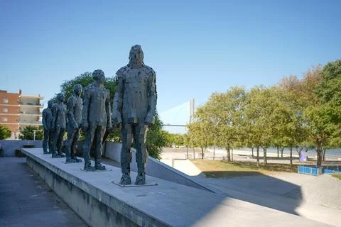 Iron statues of humans lining up Stock Photos