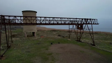 Iron structure of the crane that loaded ore into freight train wagons from Stock Footage 229682032