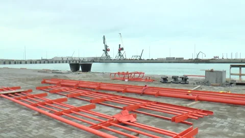 Iron structure in the seaport and two cranes in the background Stock Footage 232213813