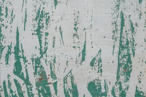 Iron surface is covered with remnants of old paint, grey texture, background Stock Photos