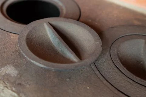 Iron surface old rusty hole cover kindling furnace design traditional oven Stock Photos
