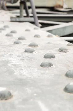 Iron surface with rivets gray hard and weathered Stock Photos