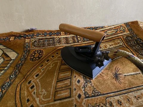 Iron on top of the table Stock Photos