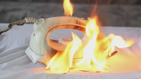 The iron, which was not turned off, burned through the shirt and caused a fire. Stock Footage 153746980