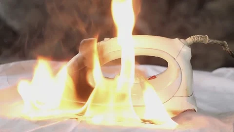 The iron, which was not turned off, burned through the shirt and caused a fire  Stock Footage 153747009