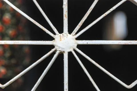 Iron window frame front of black background. Stock Photos