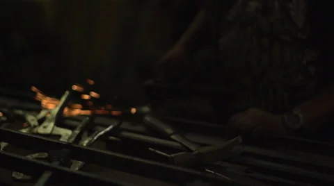 Iron worker cutting with a saw Stock Footage 40363529