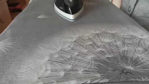 Ironing bed linen, close-up. Iron in a female hand Stock Footage 181565987