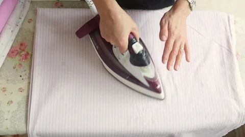 Ironing clothes Stock Footage 98003019