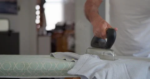 Ironing clothes at home: Stock Footage 344314647