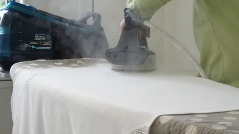 Ironing clothes in laundry with iron 스톡 동영상 85469653