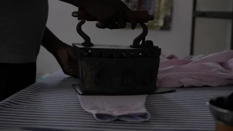 Ironing with Efficiency - Hand-Powered Ironing Machine Video stock 318482838