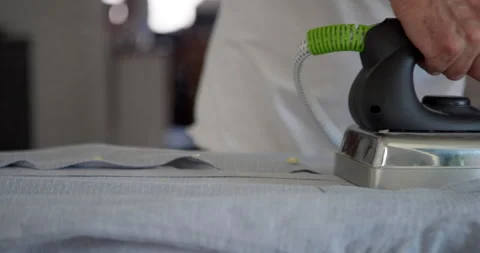 Ironing a Grey Fabric: 库存影片 344312939