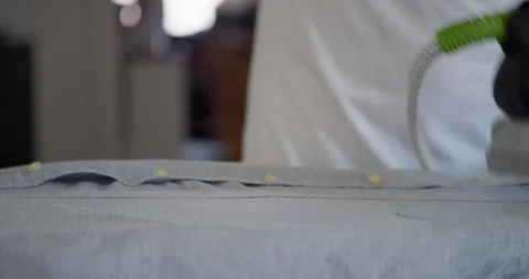 Ironing a Grey Fabric: 库存影片 344313871