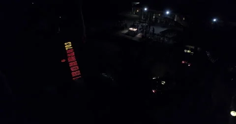 IRONMAN 70.3 Logo made and lighted by candles on the beach Stock Footage 154997053