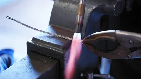 Ironworker Braid Metal Wire With Torch, Vice Grips, &amp; Hammer Slow Motion 4K Video stock 151434744