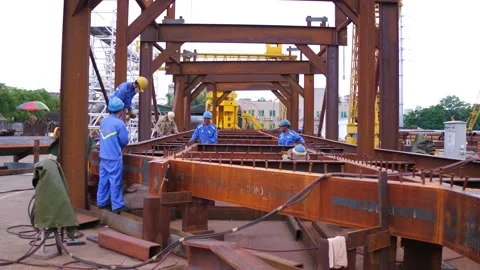 Ironworkers Working On Structural Frame Of A Bridge Under Construction. Stock Footage 161132267