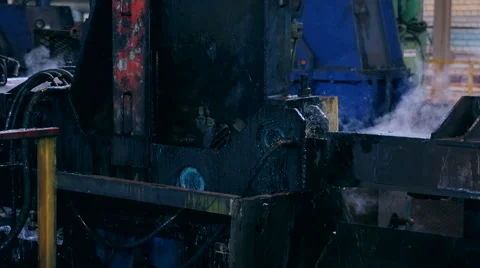 Ironworks plant. Machine bends burning hot billet Stock Footage 68292129
