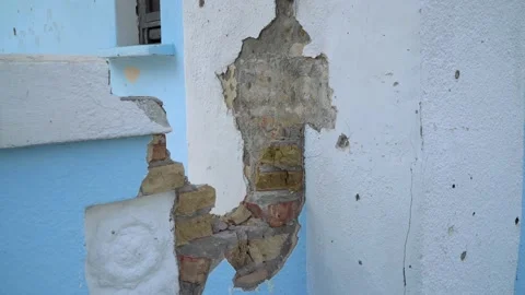 Irpin 2022. A hole in the wall from Russian artillery in the cultural center Stock Footage