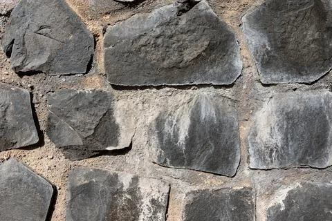 Irregular coursed masonry texture, rustic natural quarry stone wall Stock-Fotos