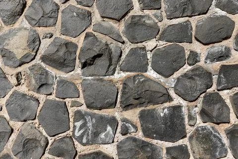 Irregular coursed masonry texture, rustic natural quarry stone wall Stock-Fotos
