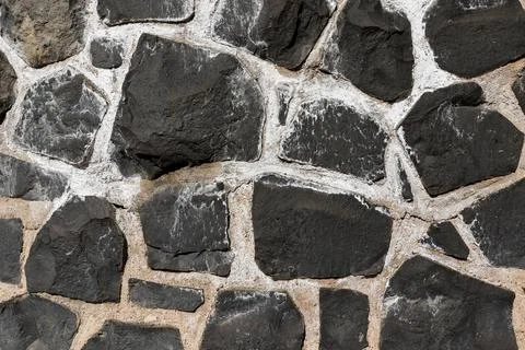 Irregular coursed masonry texture, rustic natural quarry stone wall Stock-Fotos