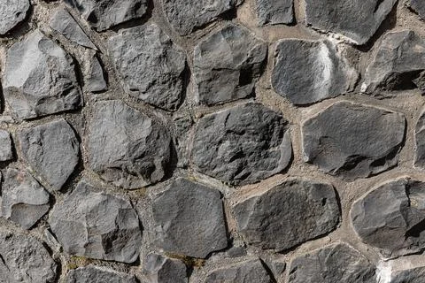 Irregular coursed masonry texture, rustic natural quarry stone wall Stock Photos