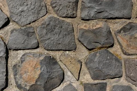 Irregular coursed masonry texture, rustic natural quarry stone wall Stock-Fotos