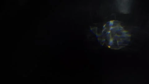 Irregular movements of crystal white bokeh in the black Stock Footage 315319239