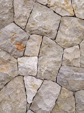Irregular natural stone wall texture background benicasim Fotos Stock