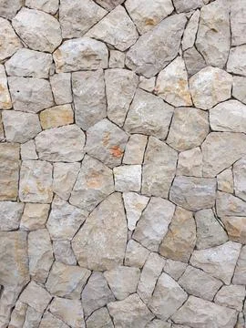 Irregular natural stone wall texture pattern in benicasim Stock Photos