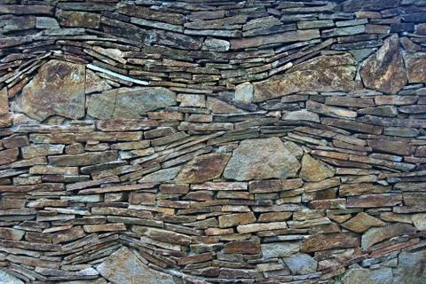An irregular pattern composed from small and larger stones Stock Photos