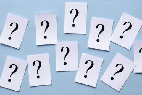 Irregular rows of printed question marks Stock-Fotos