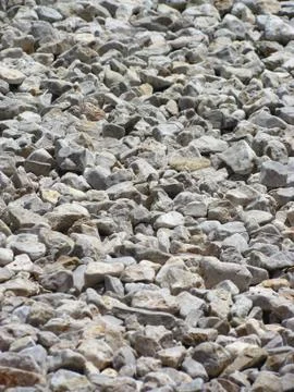 Irregular shaped pebbles on a beach Fotos Stock