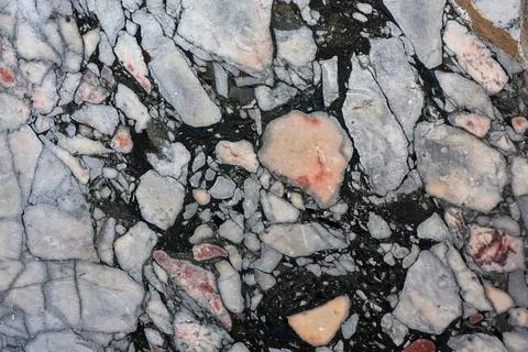 Irregular stone pieces forming a textured natural pattern Stock Photos