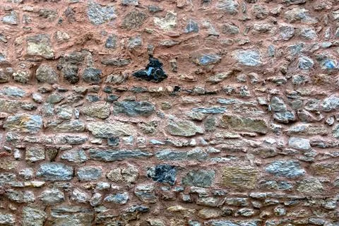 Irregular stone wall texture background photo Stock Photos