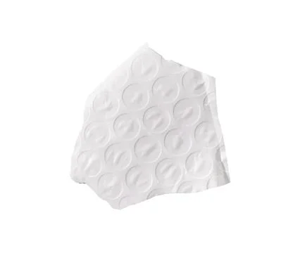 Irregular torn bubble wrap piece showing circular cell texture isolated on .. Foto stock