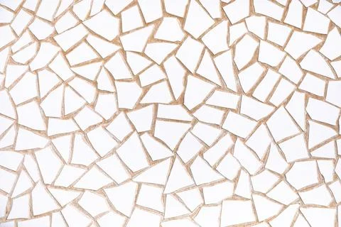 Irregular white mosaic tiles forms textured background Stock Photos