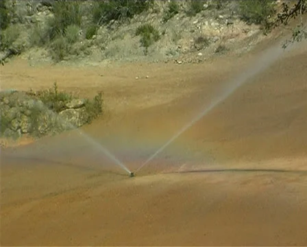 Irrigating a golf course Stock Footage 25887901