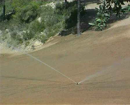 Irrigating a golf course Stock Footage 25888017