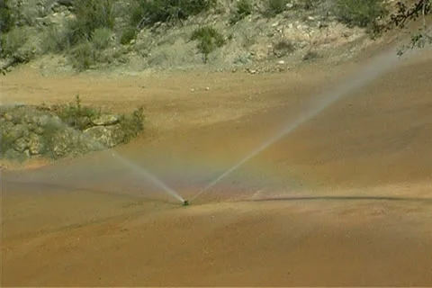 Irrigating a golf course Stock Footage 25914247