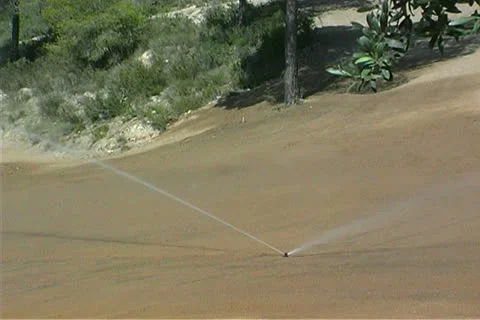 Irrigating a golf course Stock Footage 25914269
