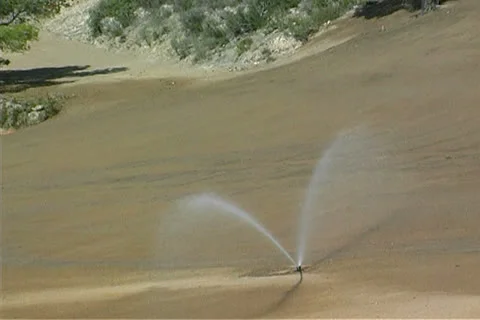 Irrigating a golf course Stock Footage 25914286