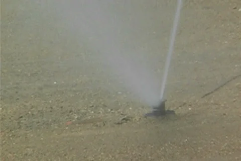 Irrigating a golf course Stock Footage 25914295