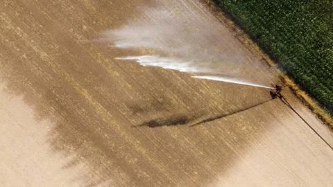 Irrigating maize in the summer Stock Photos