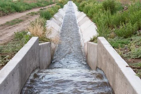Irrigation Ditch With A Flow Measurement Structure Stock Photos