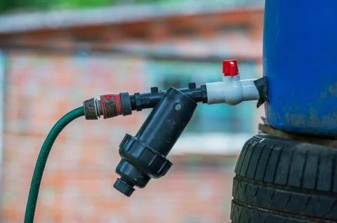 Irrigation Filter Connected to Water Storage Tank Stock Photos