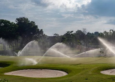 Irrigation of golf course Stock Photos